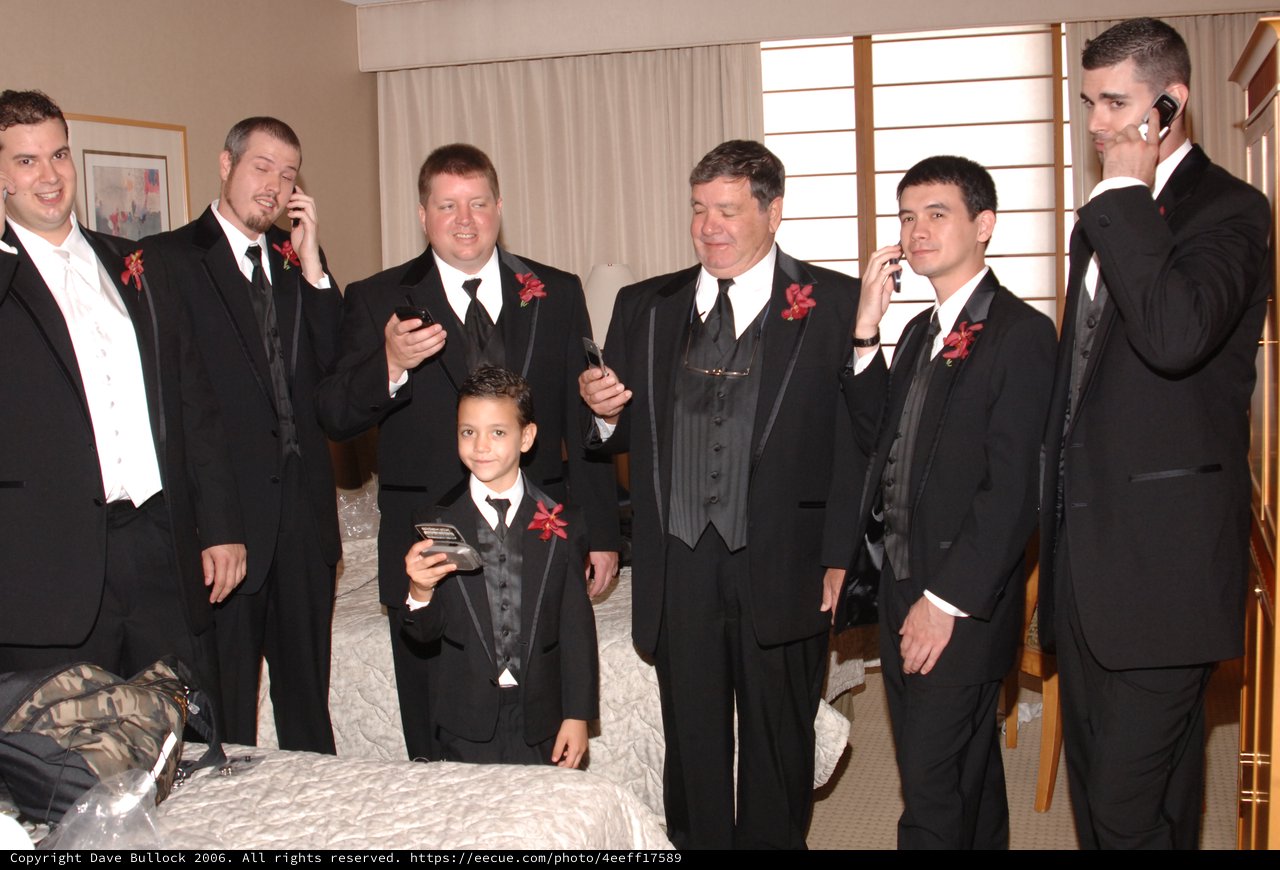 Groomsmen Checking Phones Before Wedding Ceremony