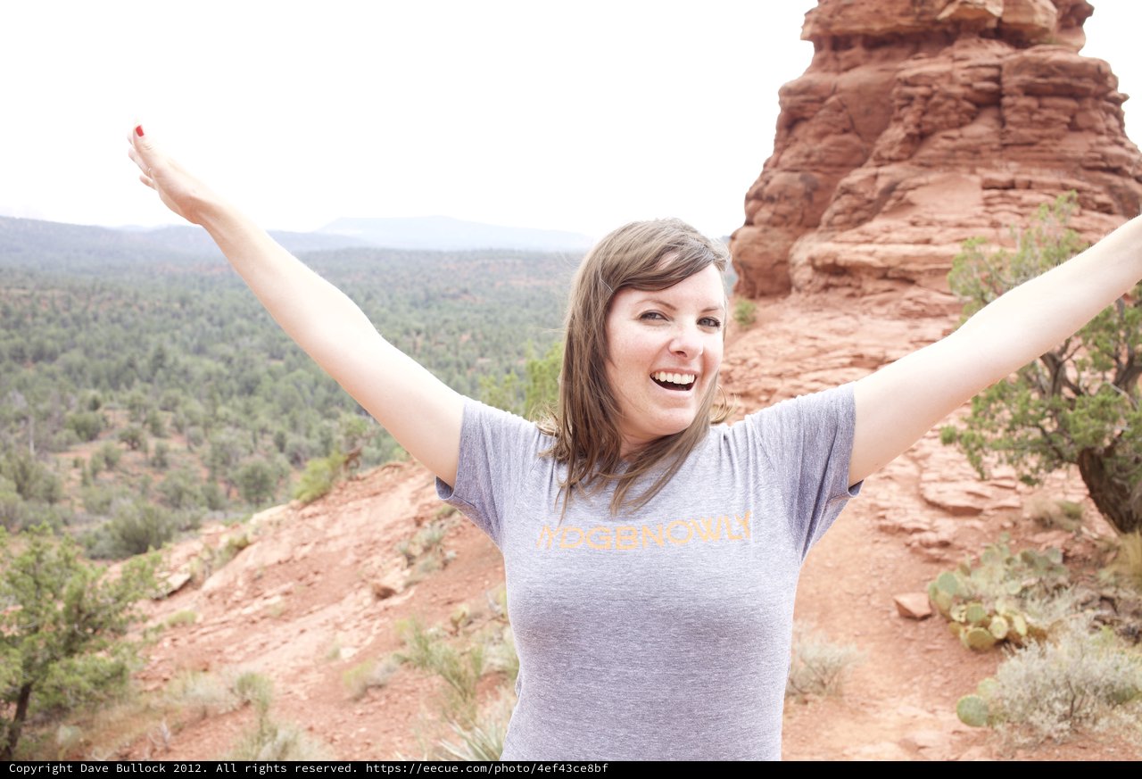 Joyful Hiker Celebrates Atop Sedona Red Rock