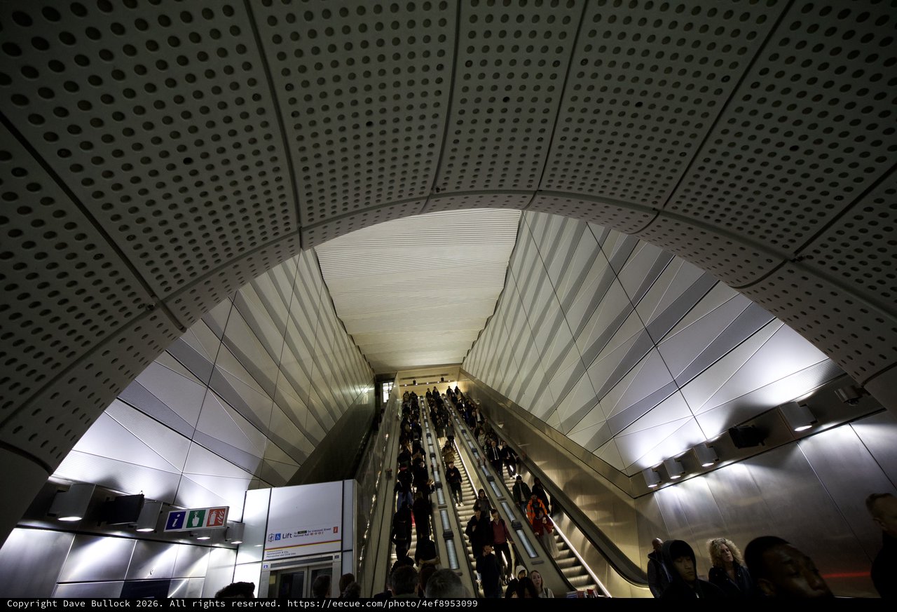 Modern Metro Station Escalators with Commuters