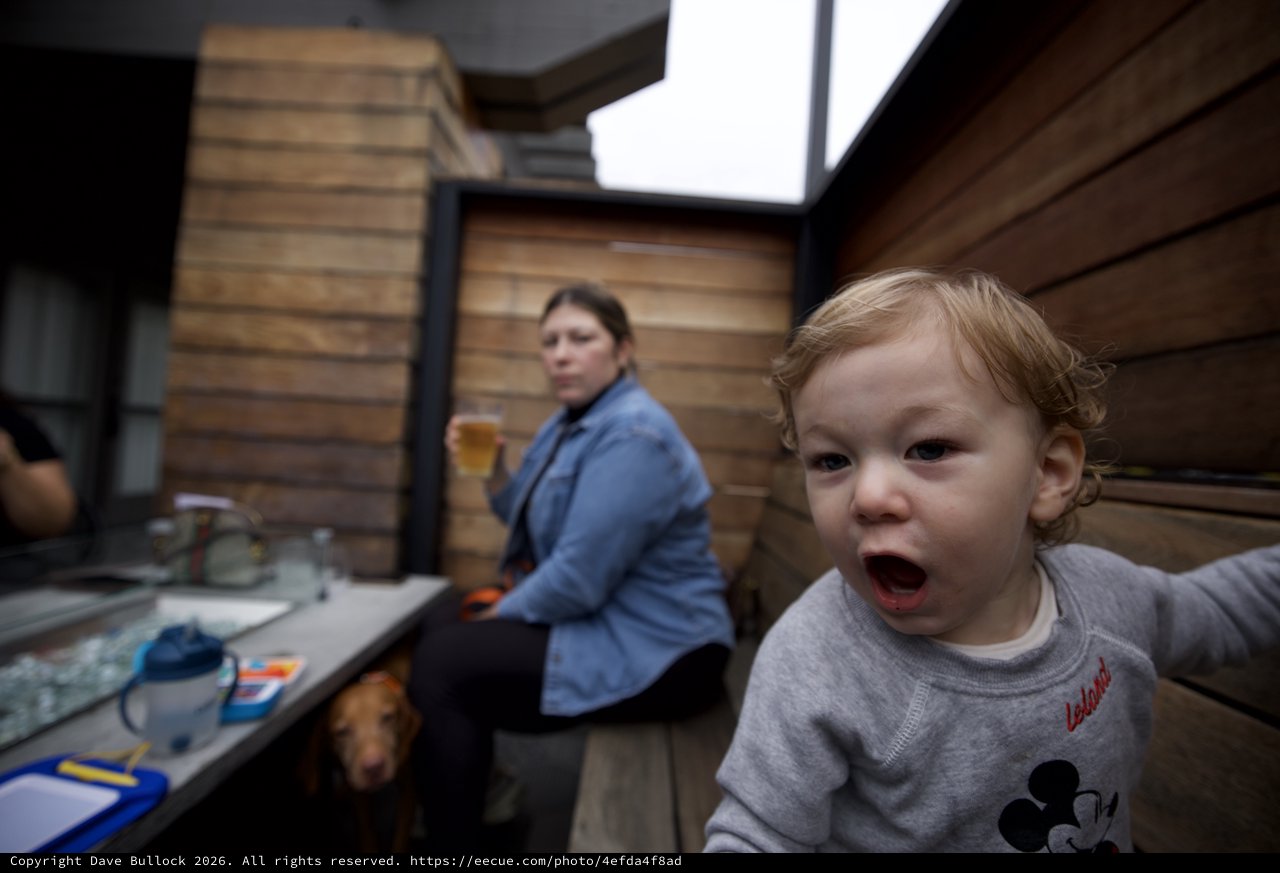 Excited Toddler's Animated Expression in Modern Kitchen