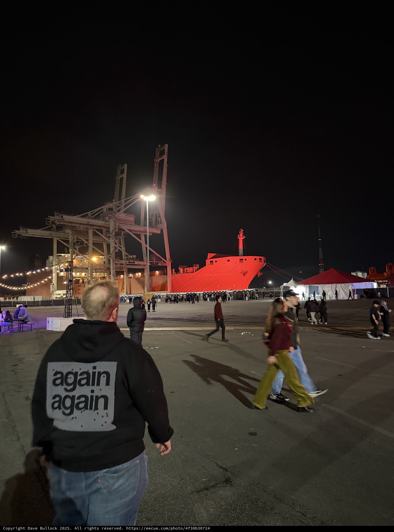 Industrial Port Night Scene with Cargo Ship and Cranes