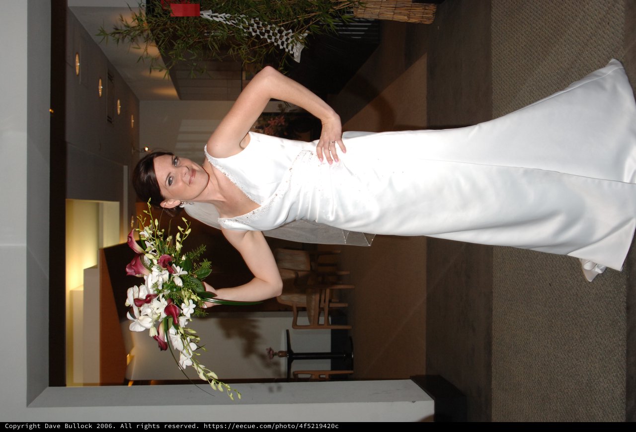 Radiant Bride Poses with Cascading Floral Bouquet