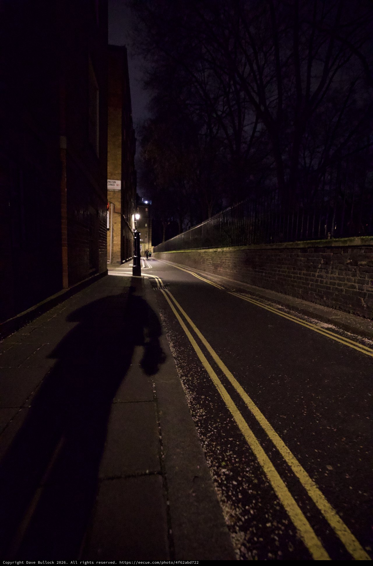 Shadow Figure on Empty London Street at Night