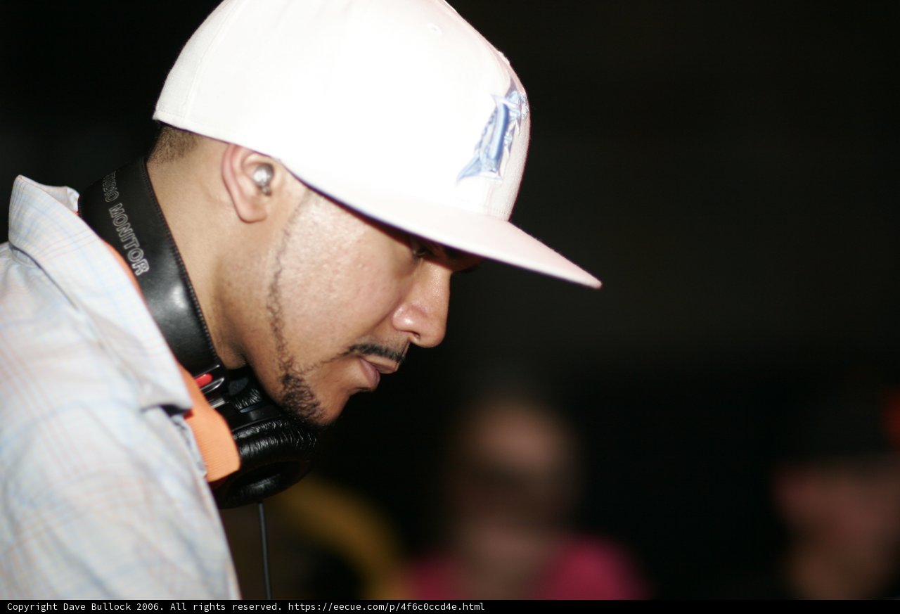 Man sporting a Hardhat and a Microphone