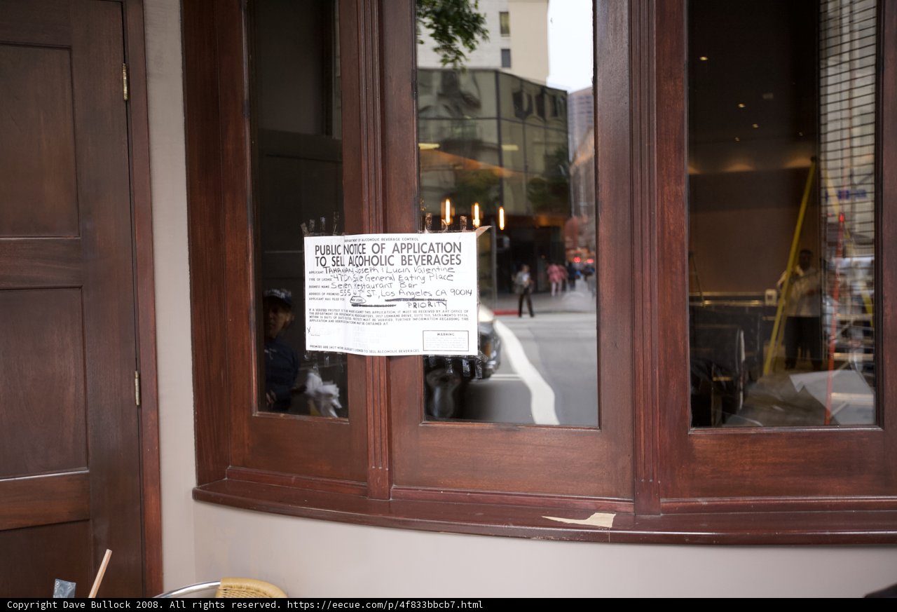 Restaurant Sign on Plywood Window