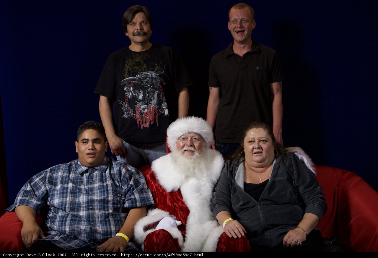 A Group of Festive People with Santa Claus