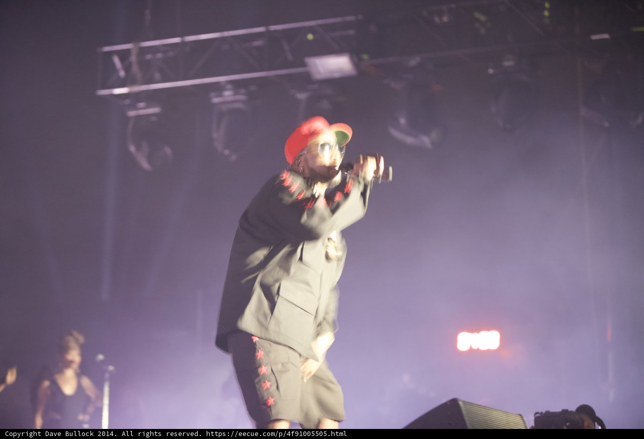 Red-Hatted Man Rocks the Stage