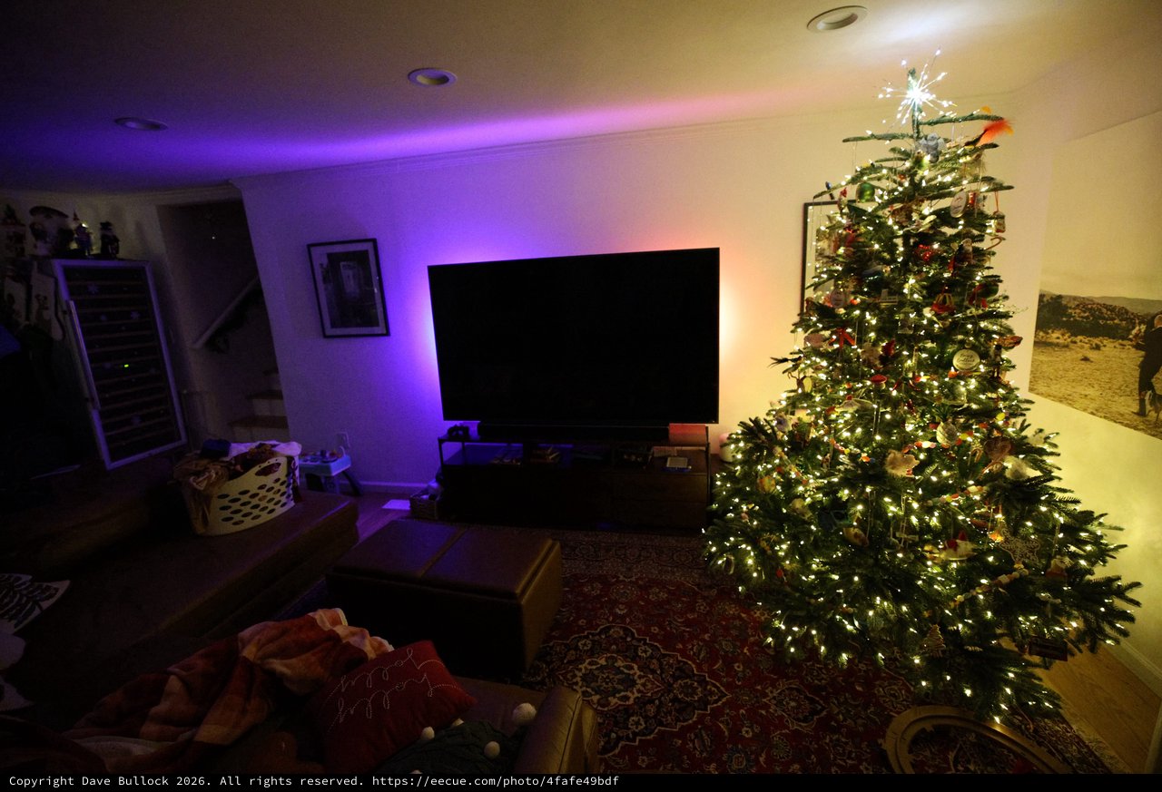 Cozy Christmas Living Room with Illuminated Tree at Night