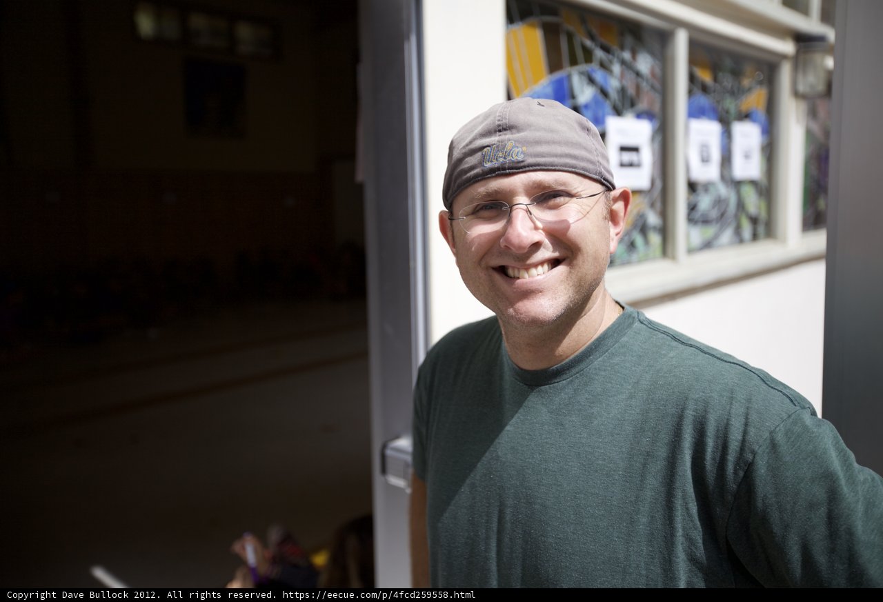The Happy Man in a Hat and Glasses