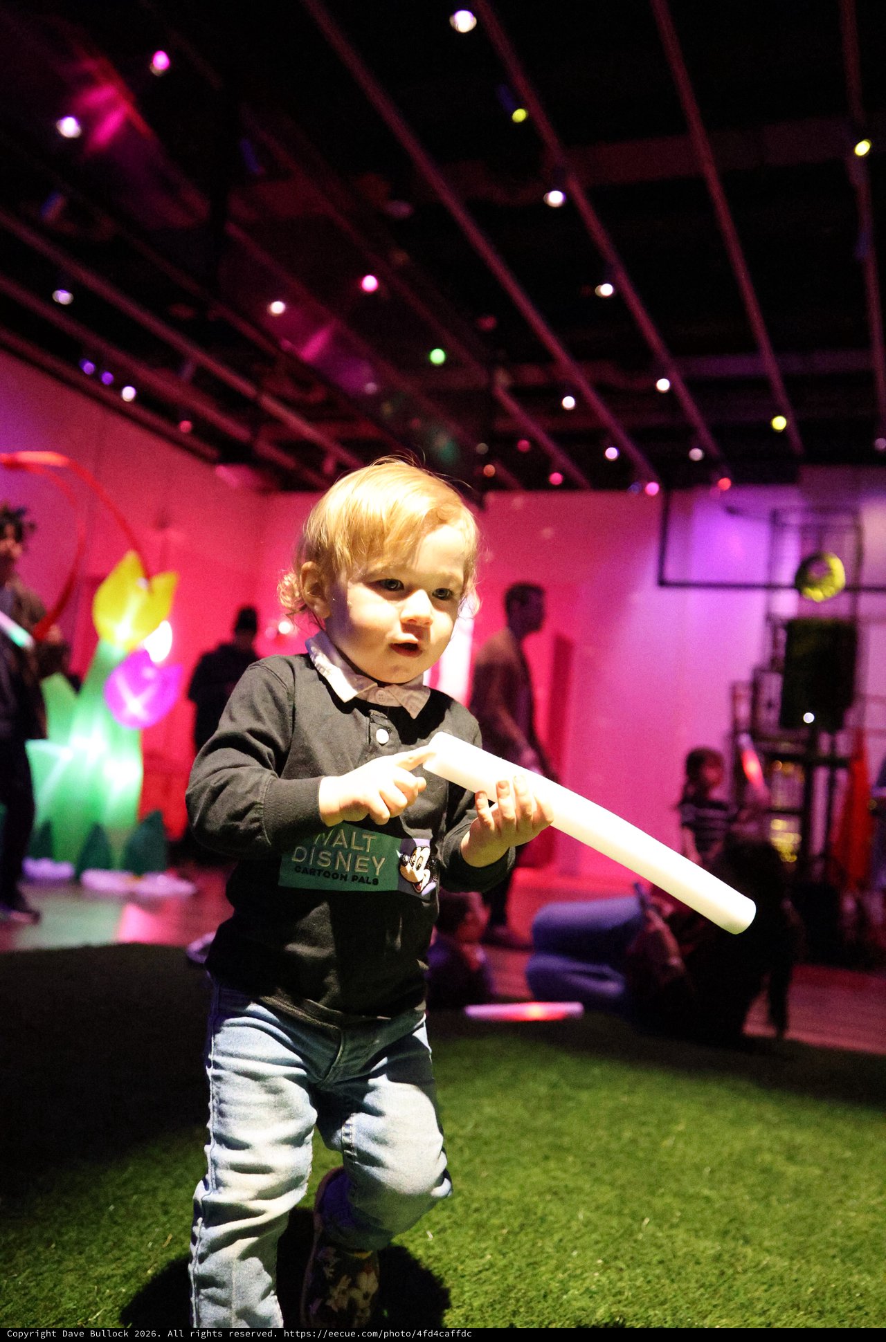 Toddler with Light Stick at Baby Rave Event