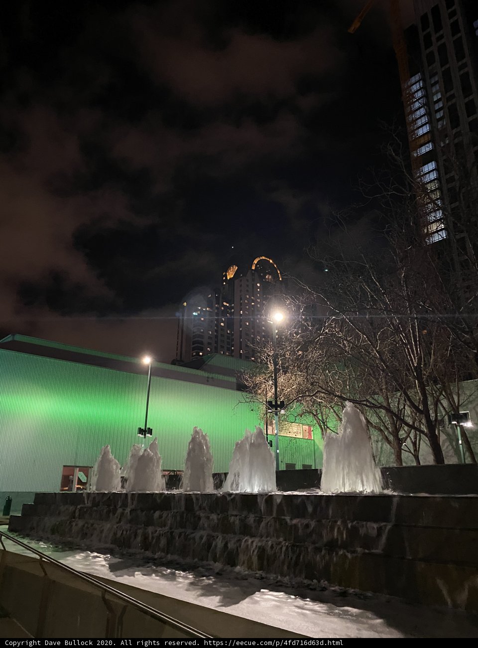 Illuminated Fountain in a Metropolis