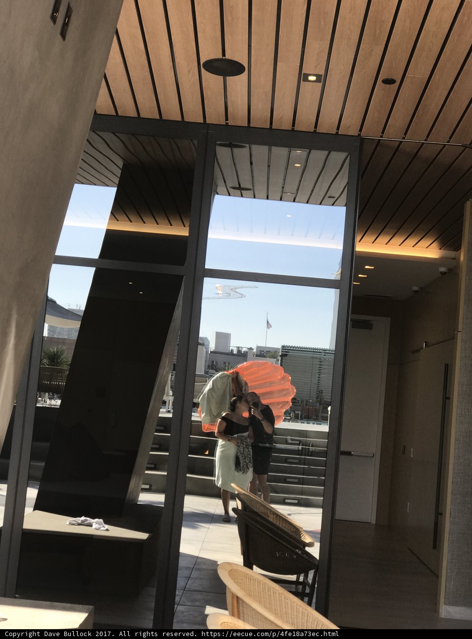 Umbrella Lady in Plywood Building
