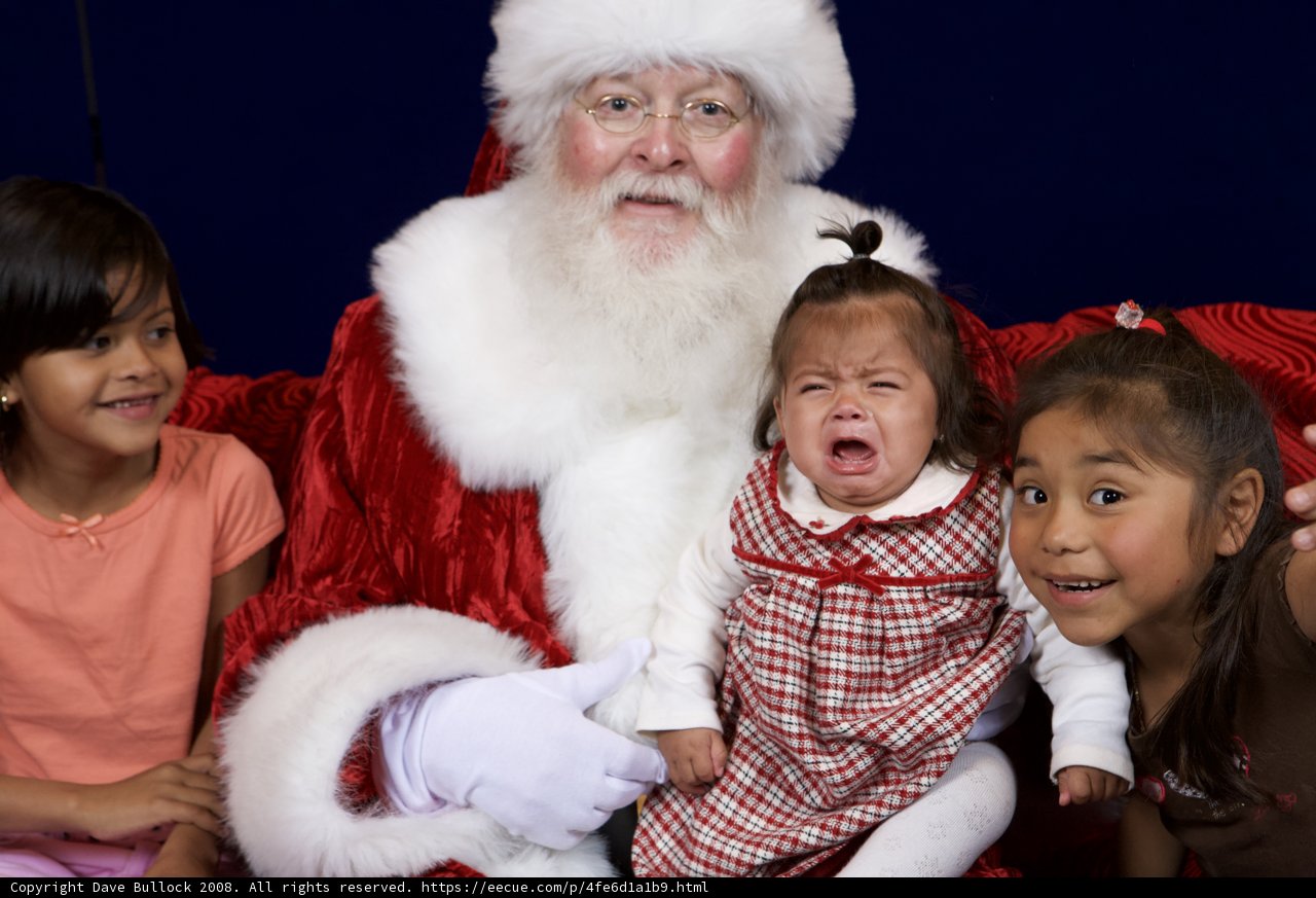 Santa Claus spreading joy with three children
