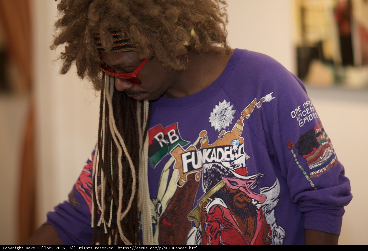 Purple-Shirted Dreadlocked Man