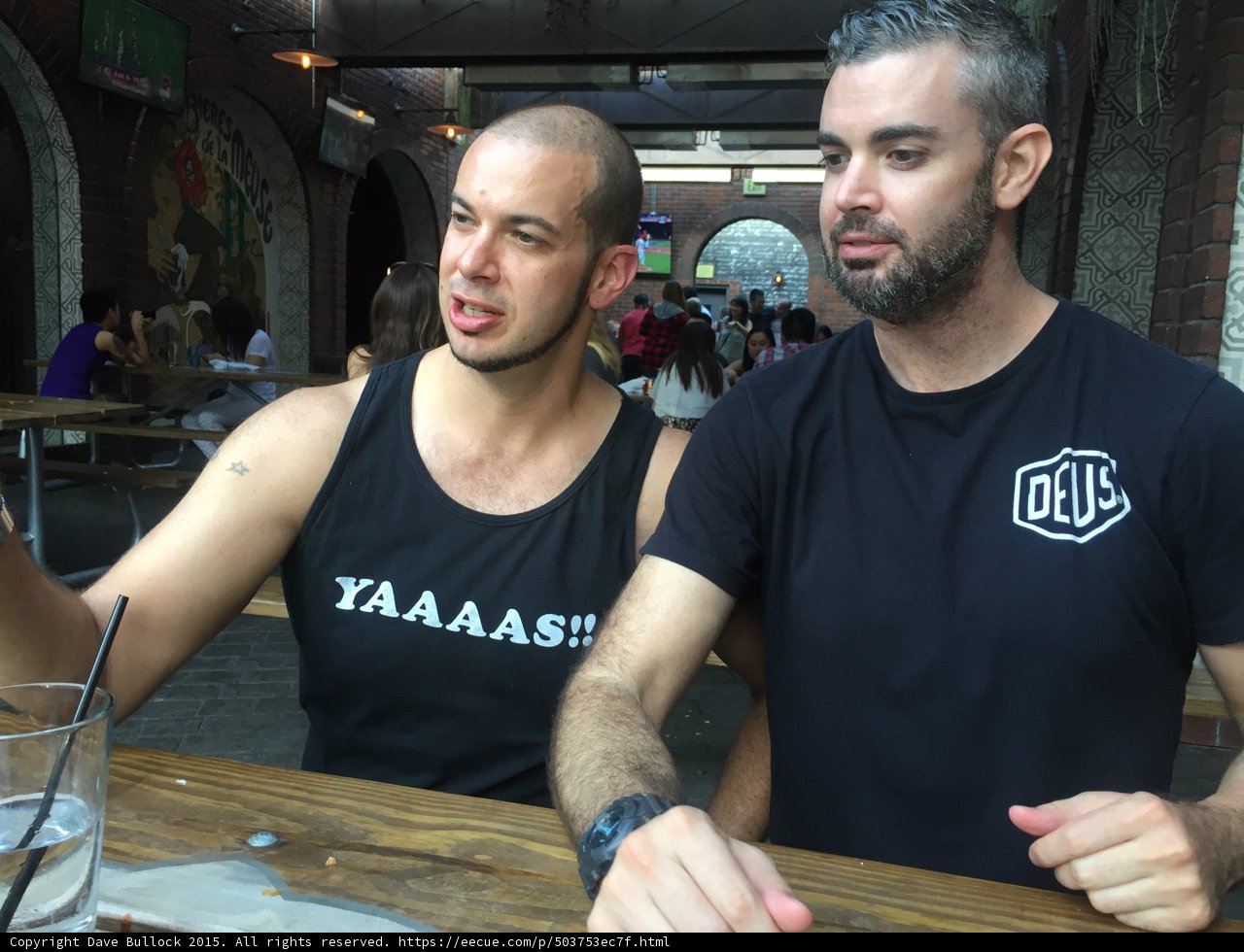 Two Friends Enjoying a Drink at a Local Pub