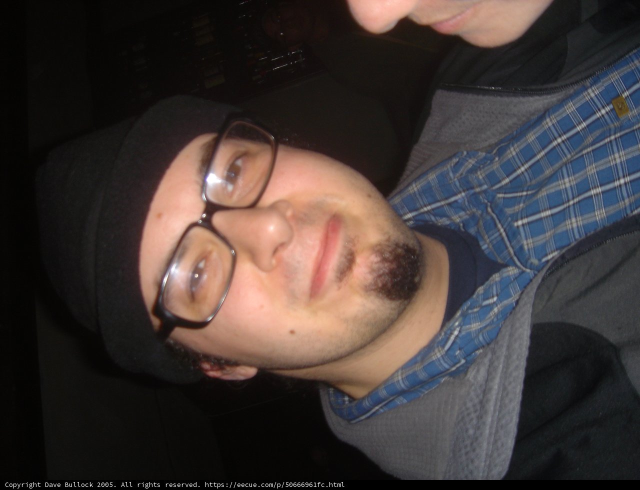 The Stylish Man with Glasses and a Hat