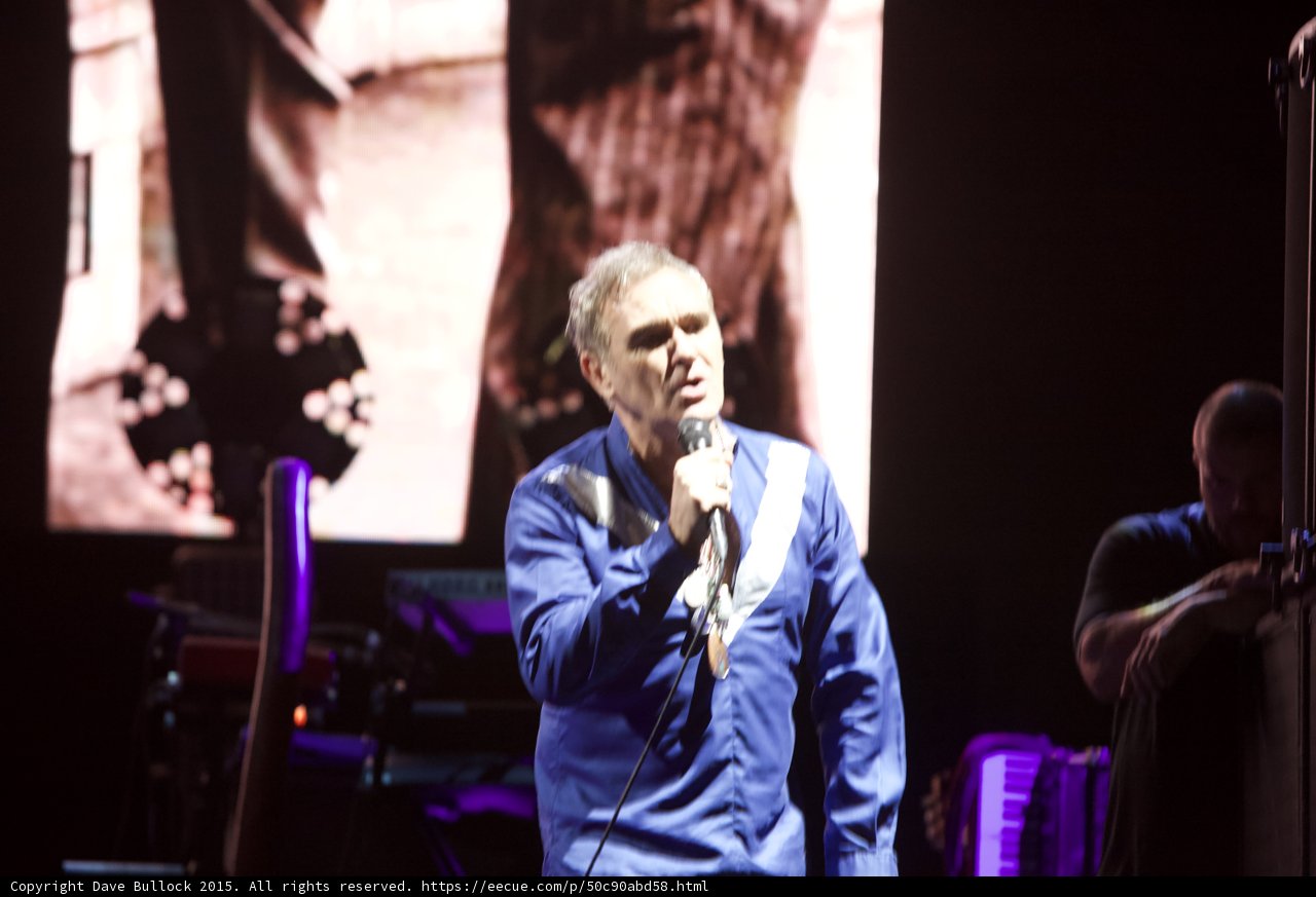 Morrissey Three Quarter Singing Blue Shirt Necklaces Smiths Dangling Hands Screen Bassist Shadow Keyboard