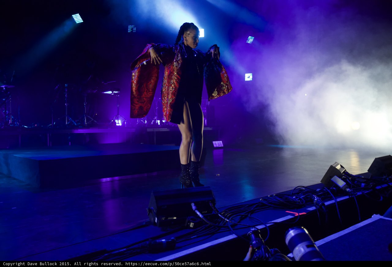 FKA twigs Incredible Full Body Wide Blue Purple Lighting Kimono Arms Spread Wings Red Brocade Gold Patterns Black Bodysuit Boots Band Haze