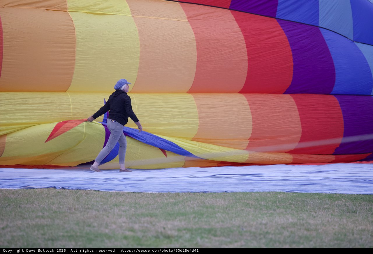 Ground Crew Wrestles Rainbow Balloon Into Life