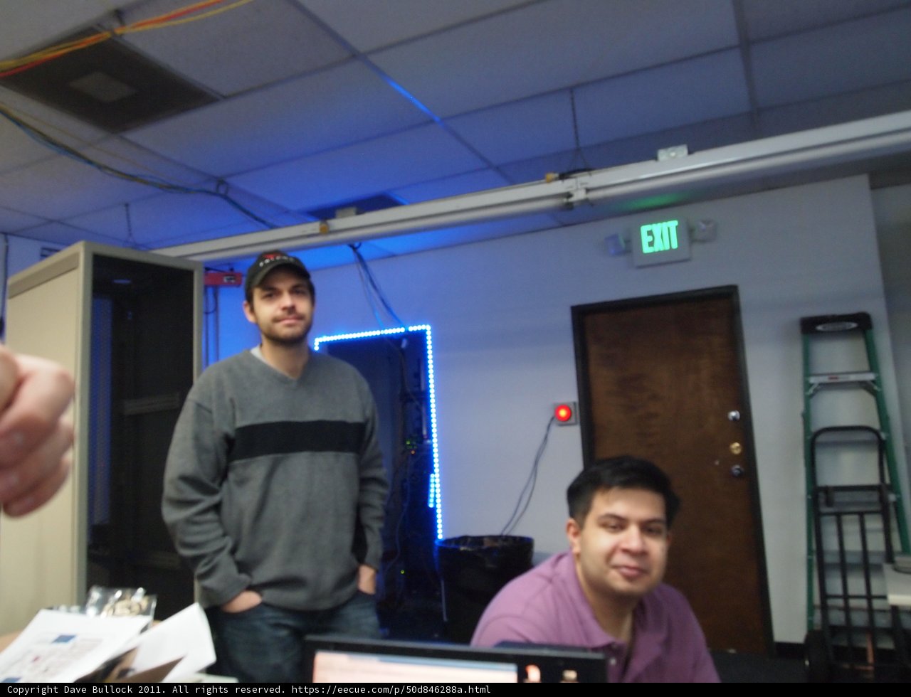 Man and Man working on a Computer Monitor