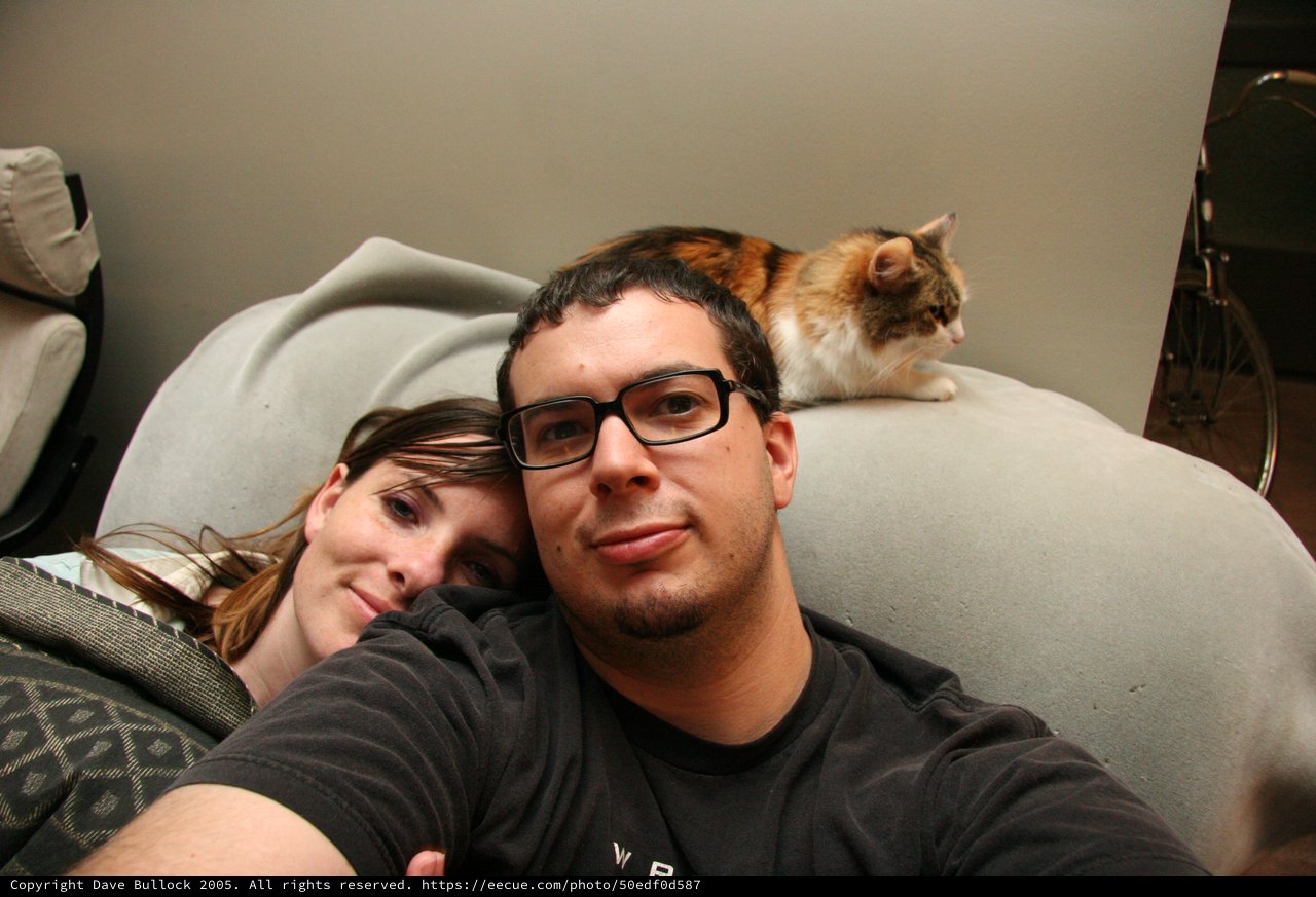 Cozy Couple Selfie with Calico Cat Companion