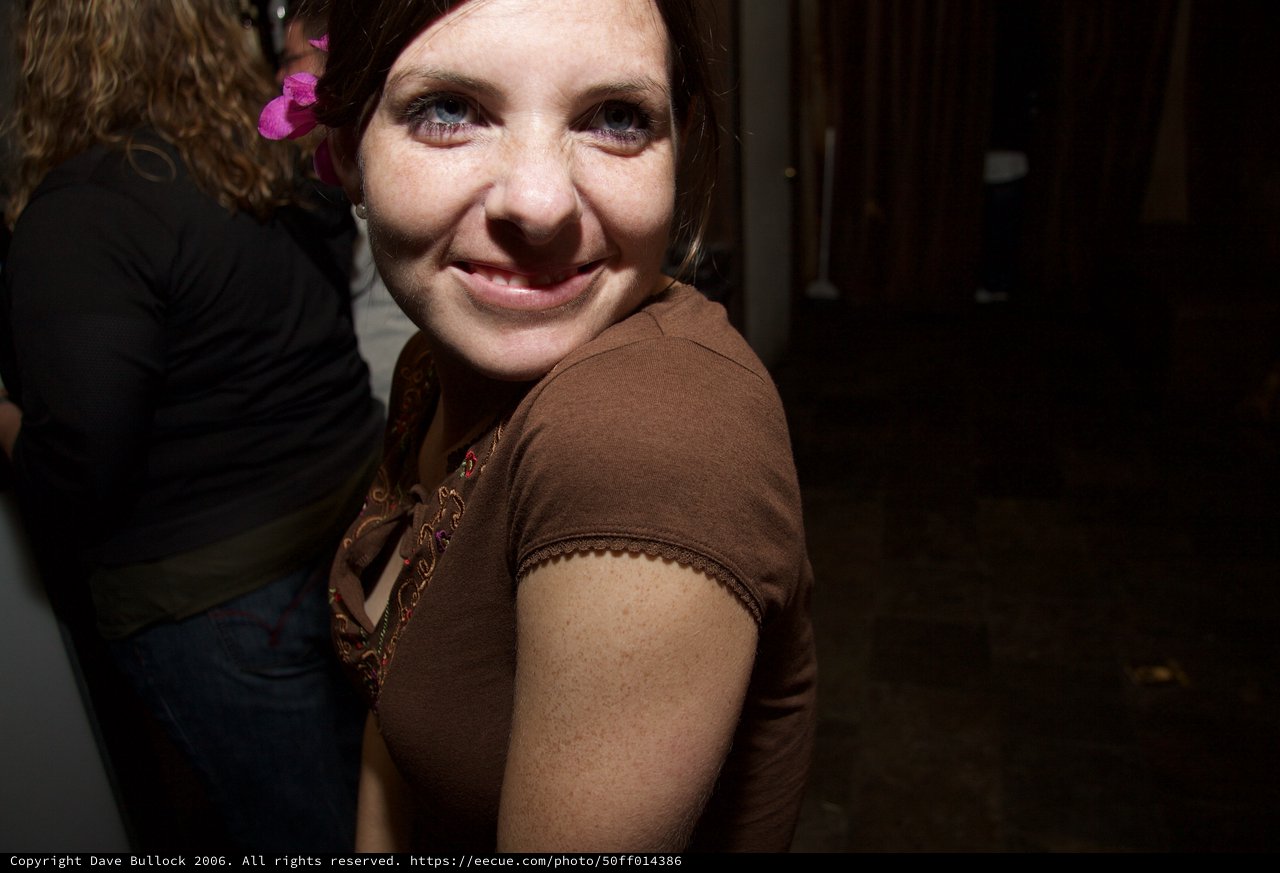 Smiling Woman with Pink Flower at Art Walk
