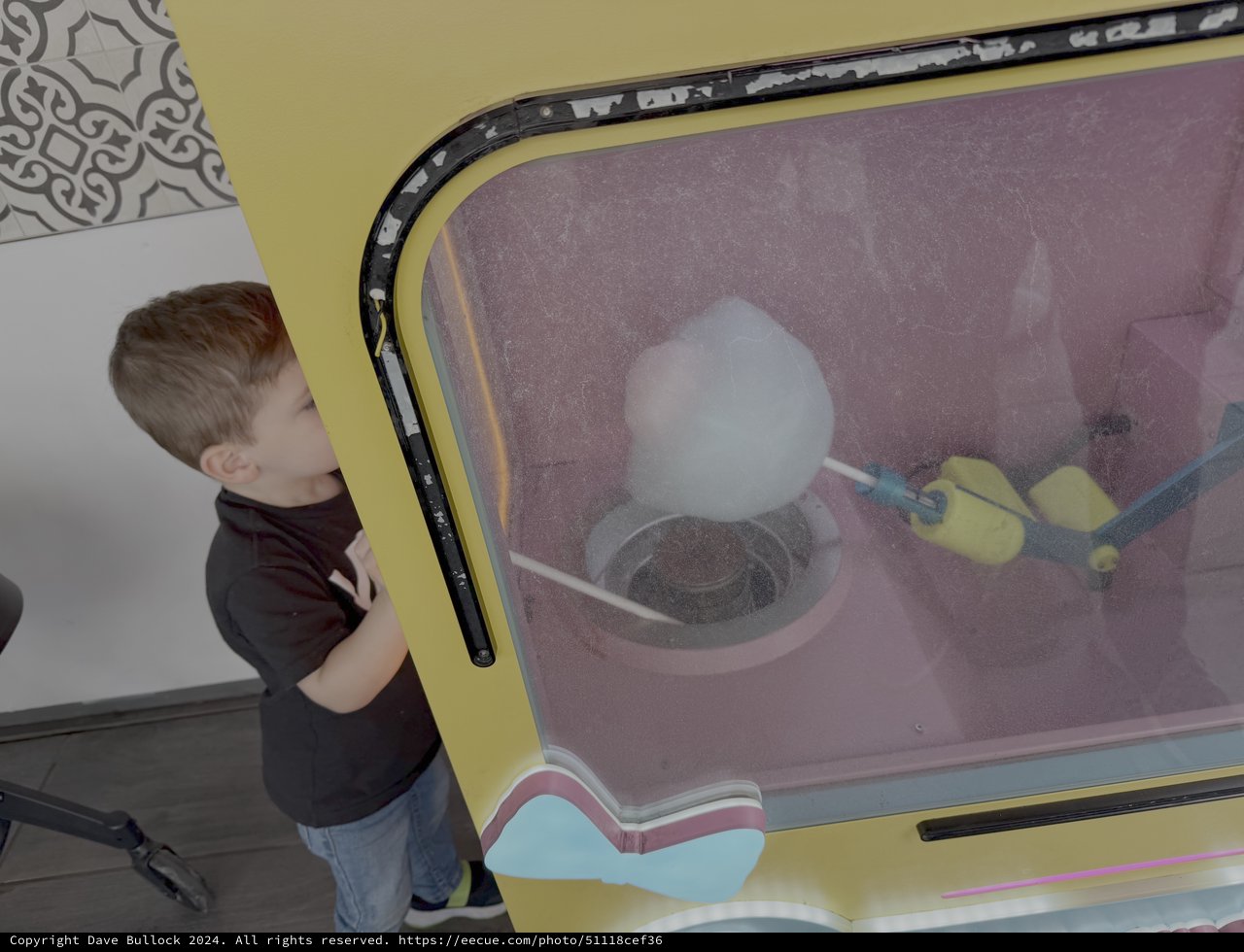 Child Watching Interactive Science Demonstration Display
