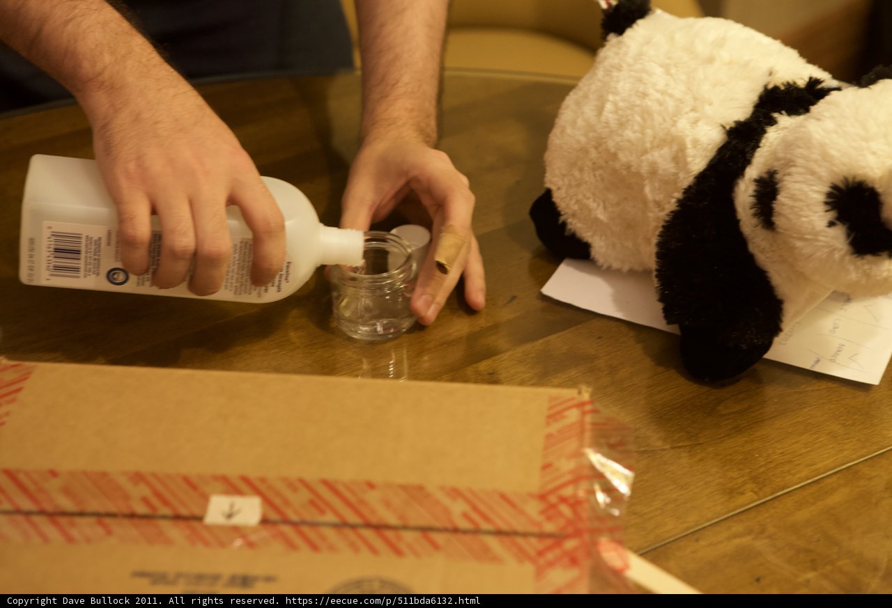 Pouring liquid into bottle of panda