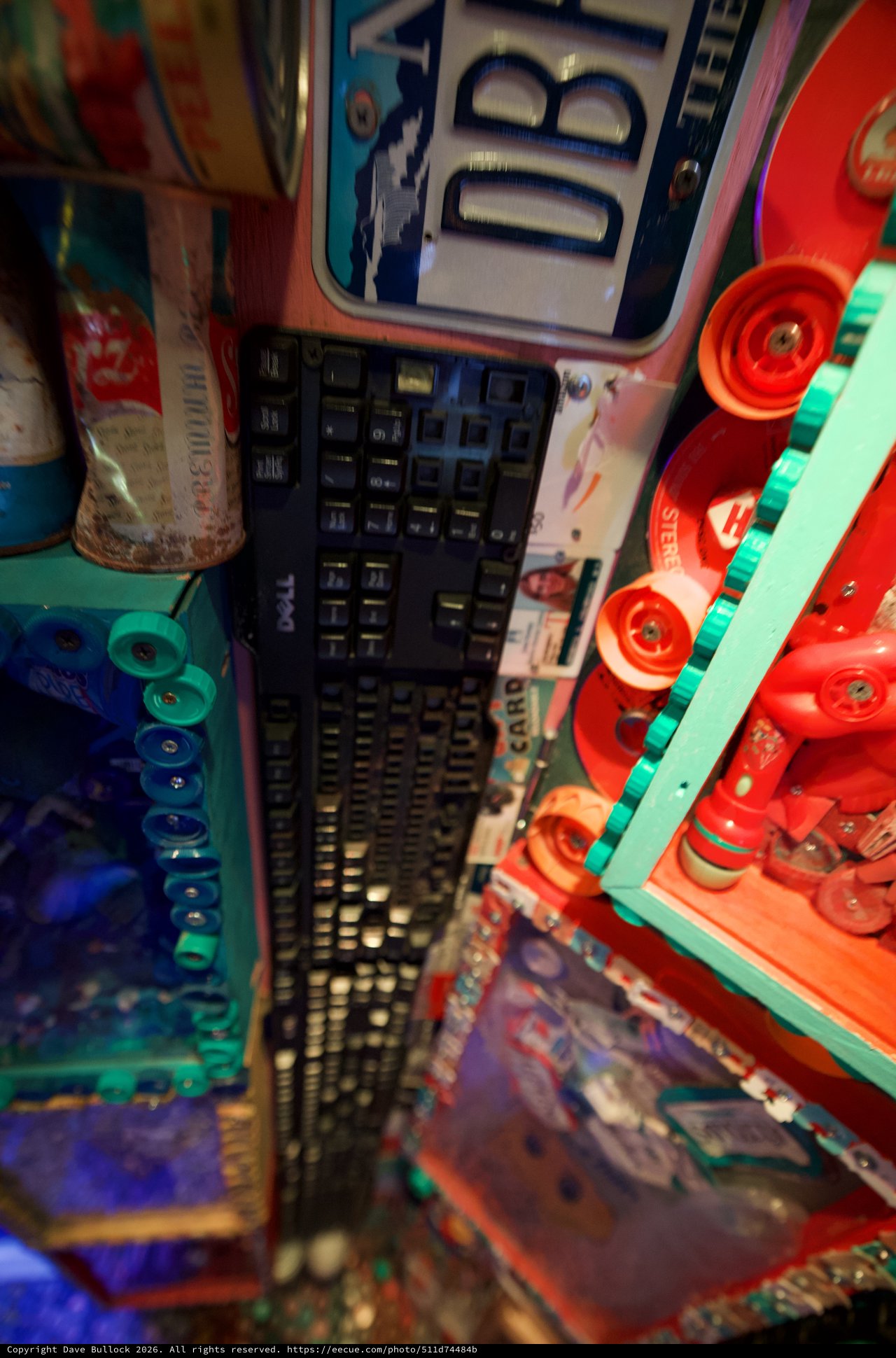 Vintage Dell Keyboard Among Colorful Retro Toys and Games