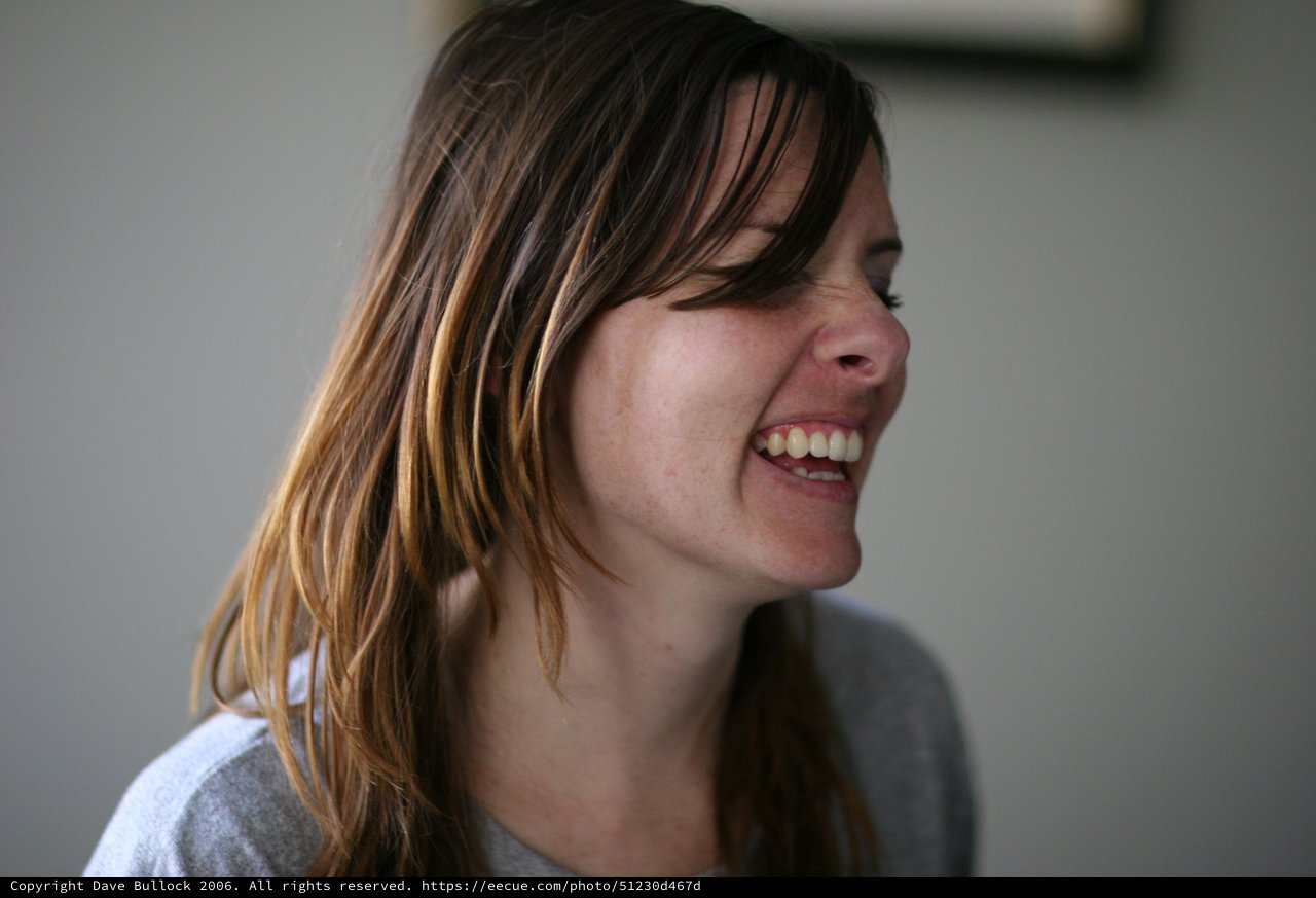 Candid Laughter: Woman with Sun-Kissed Hair