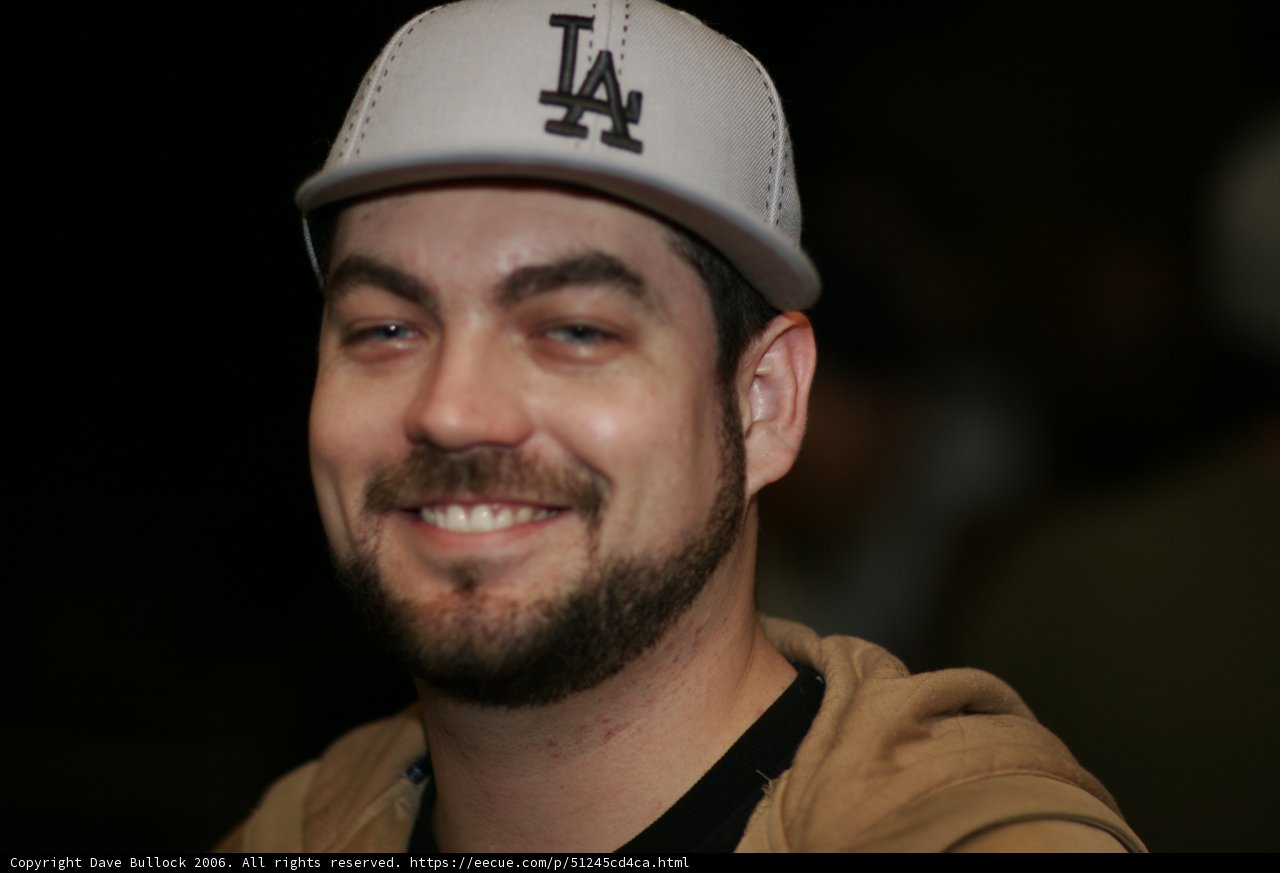 Smiling Man in Baseball Cap and Beard