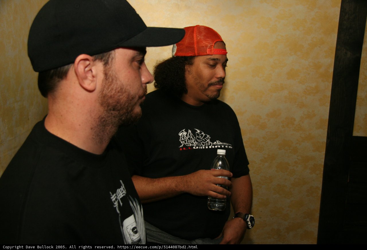 Two Men Enjoying a Beverage Break