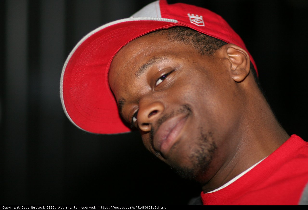 Red Shirted Man in a Baseball Cap