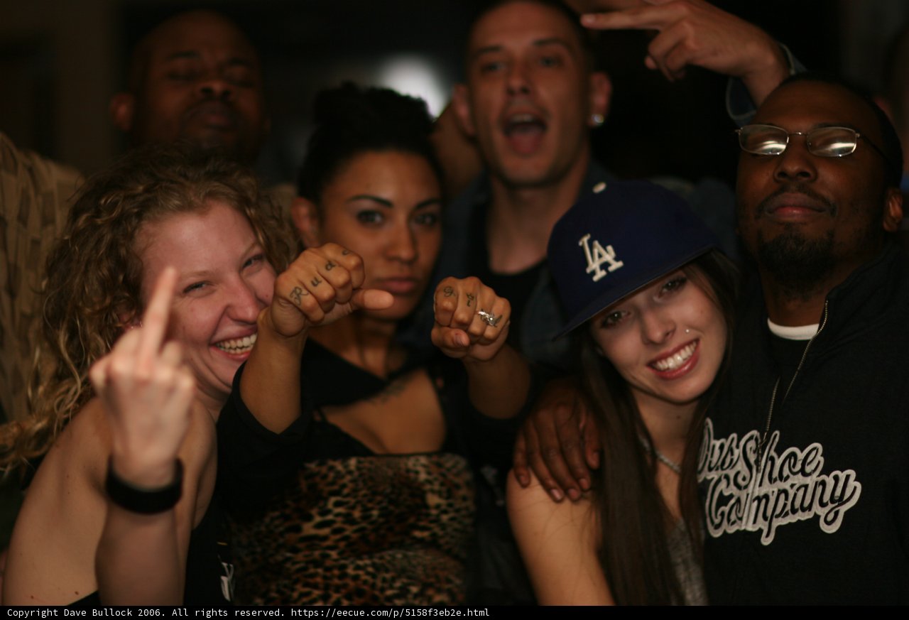 Group Poses for a Nightclub Photo
