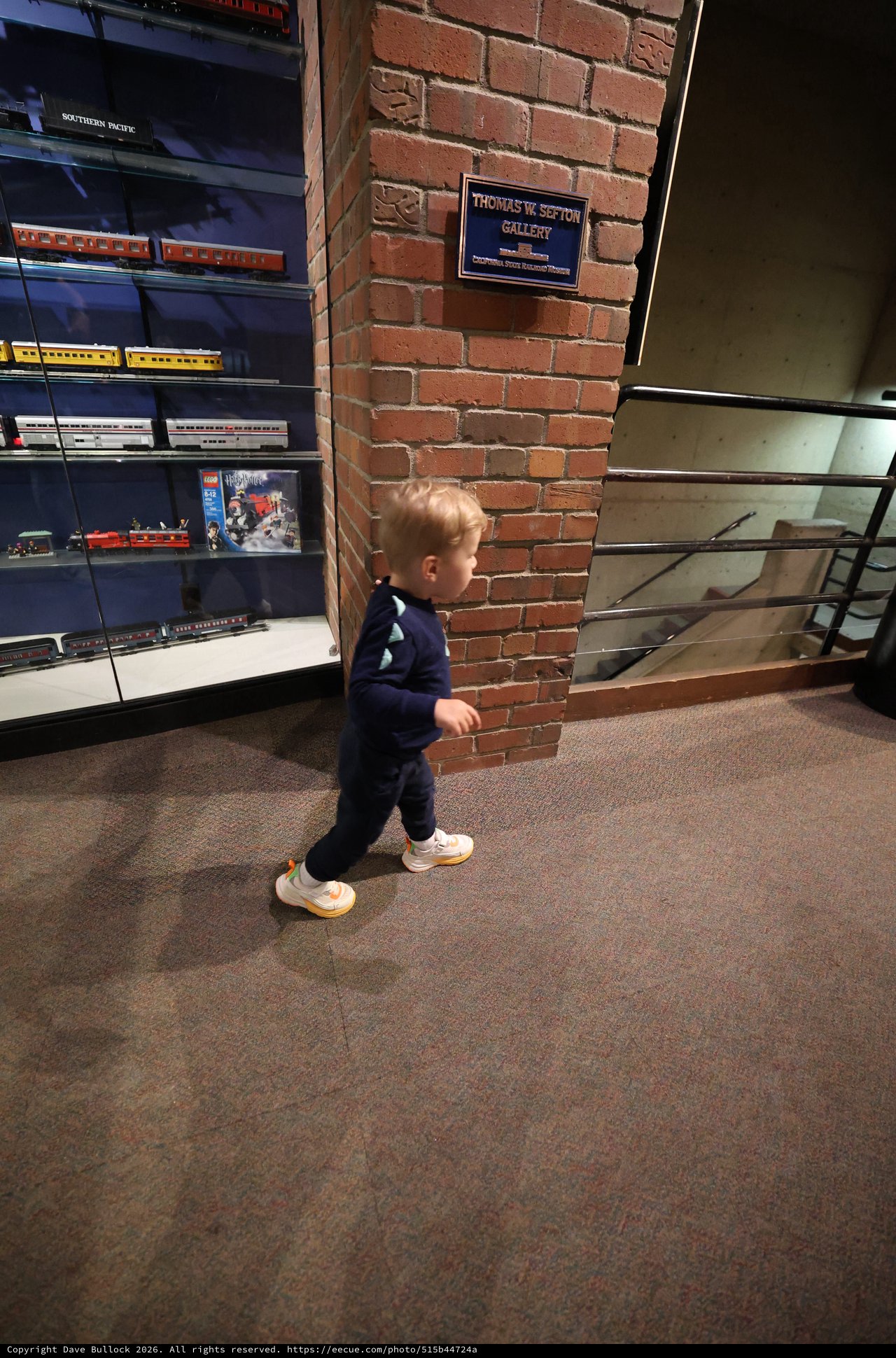 Young Child Exploring Railroad Museum Gallery