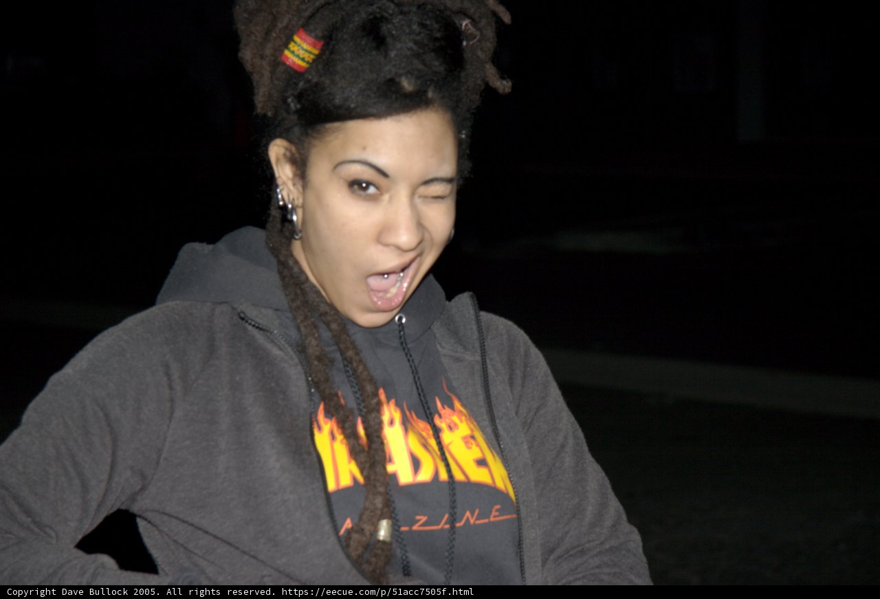 Dreadlocked Teen with Hoodie and Cell Phone