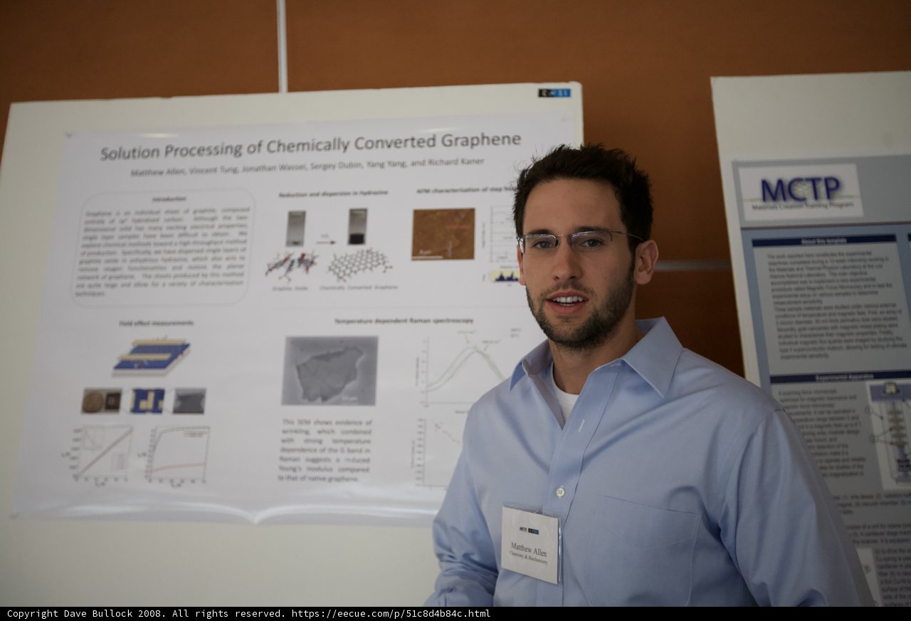 Jacopo Venturiero Standing Next to Poster