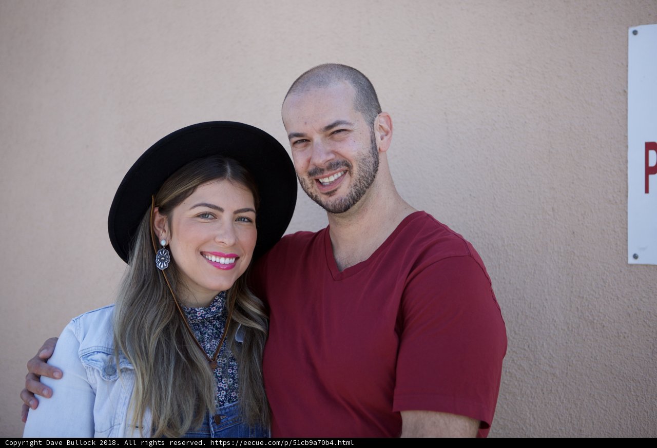 Smiling Couple in Matching Hats