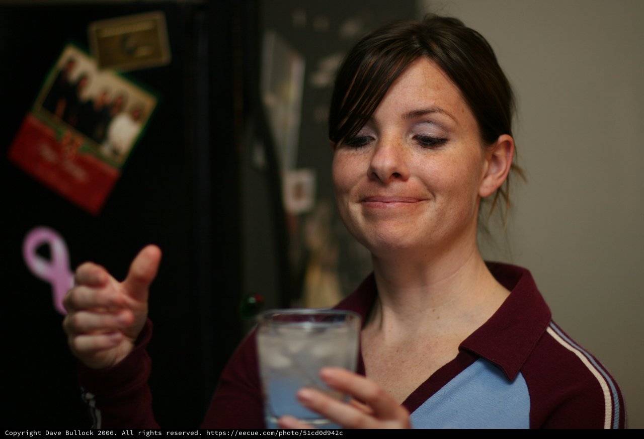 Woman Gives Thumbs Up with Iced Drink