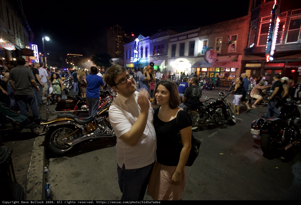 Couple Poses on Vibrant Austin Sixth Street Night