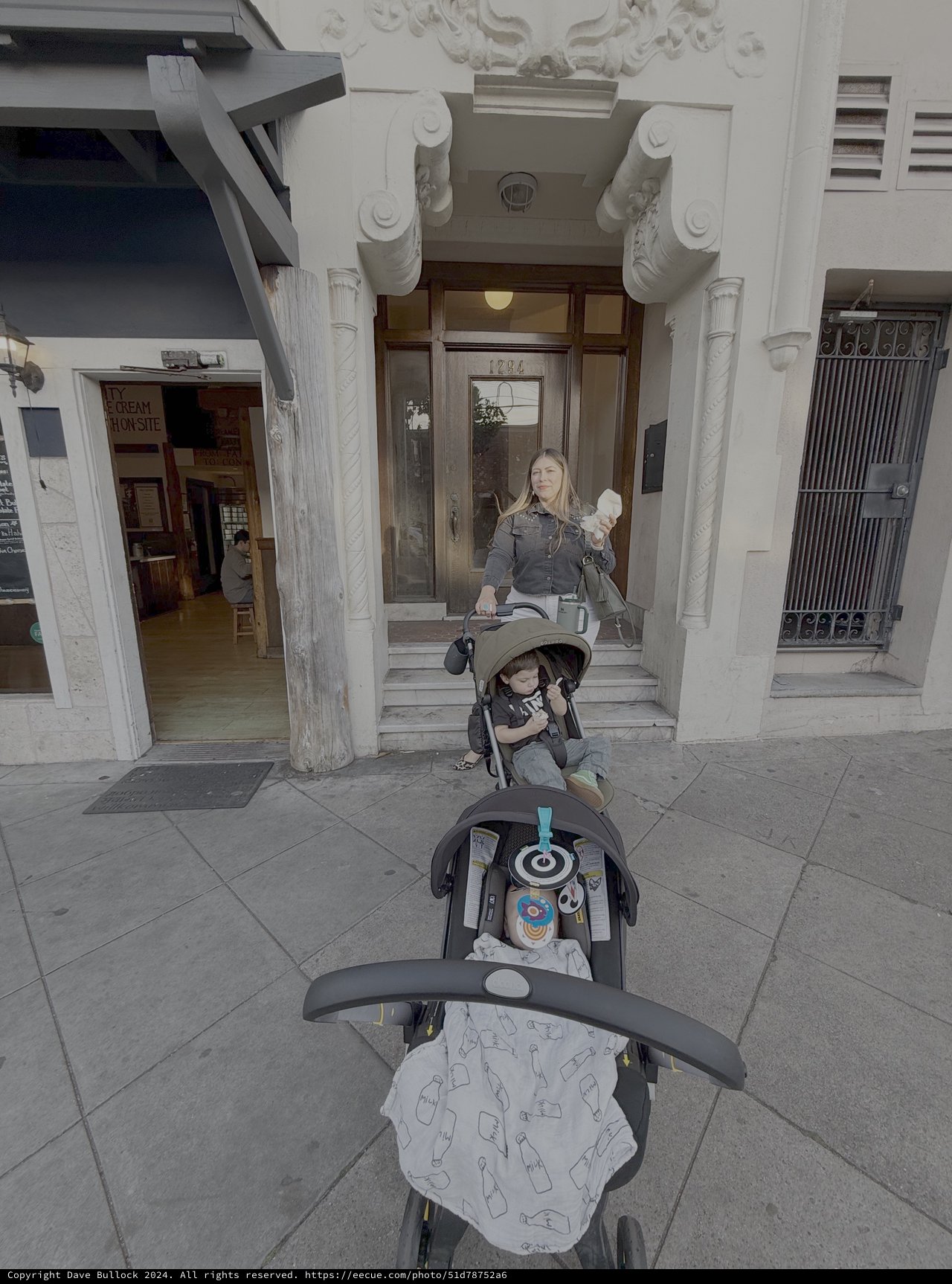 Mother with Double Stroller Outside Historic Building