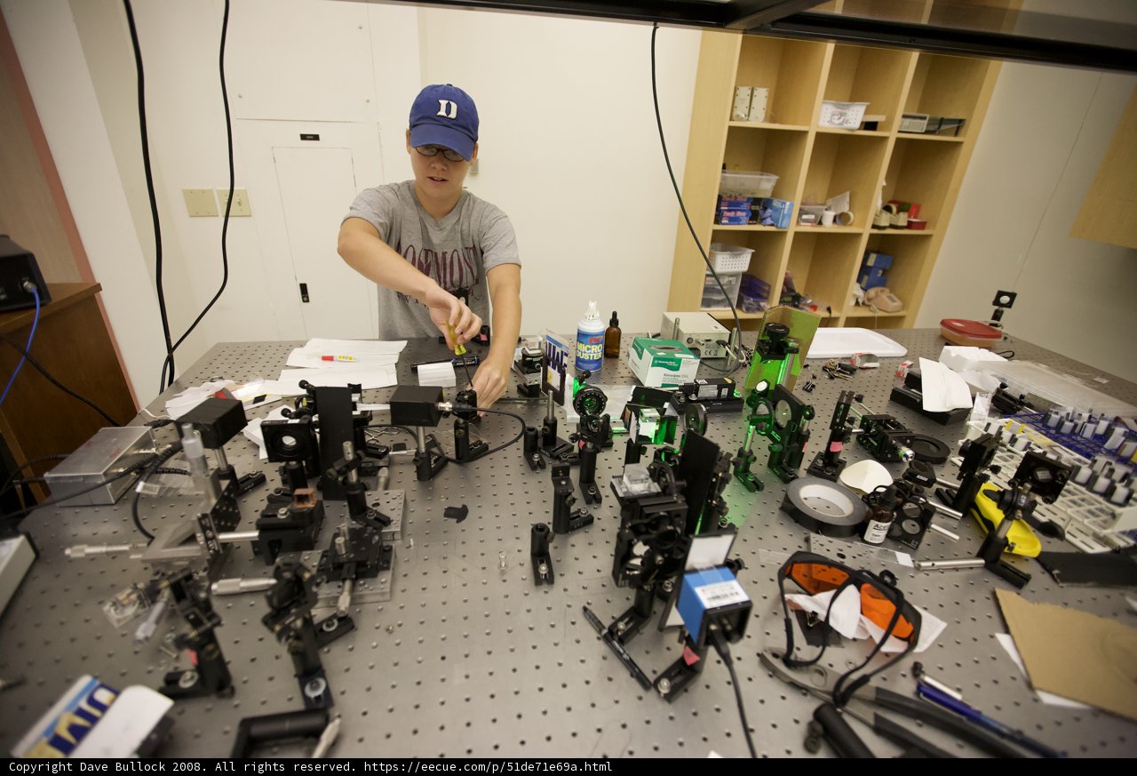 Man in Busy Laboratory Setting