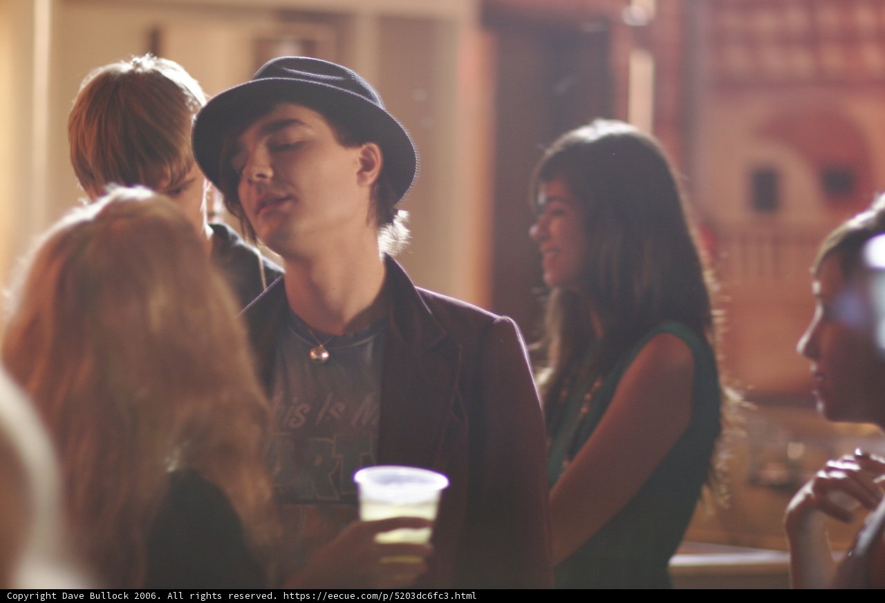 Man in Sun Hat at Urban Pub