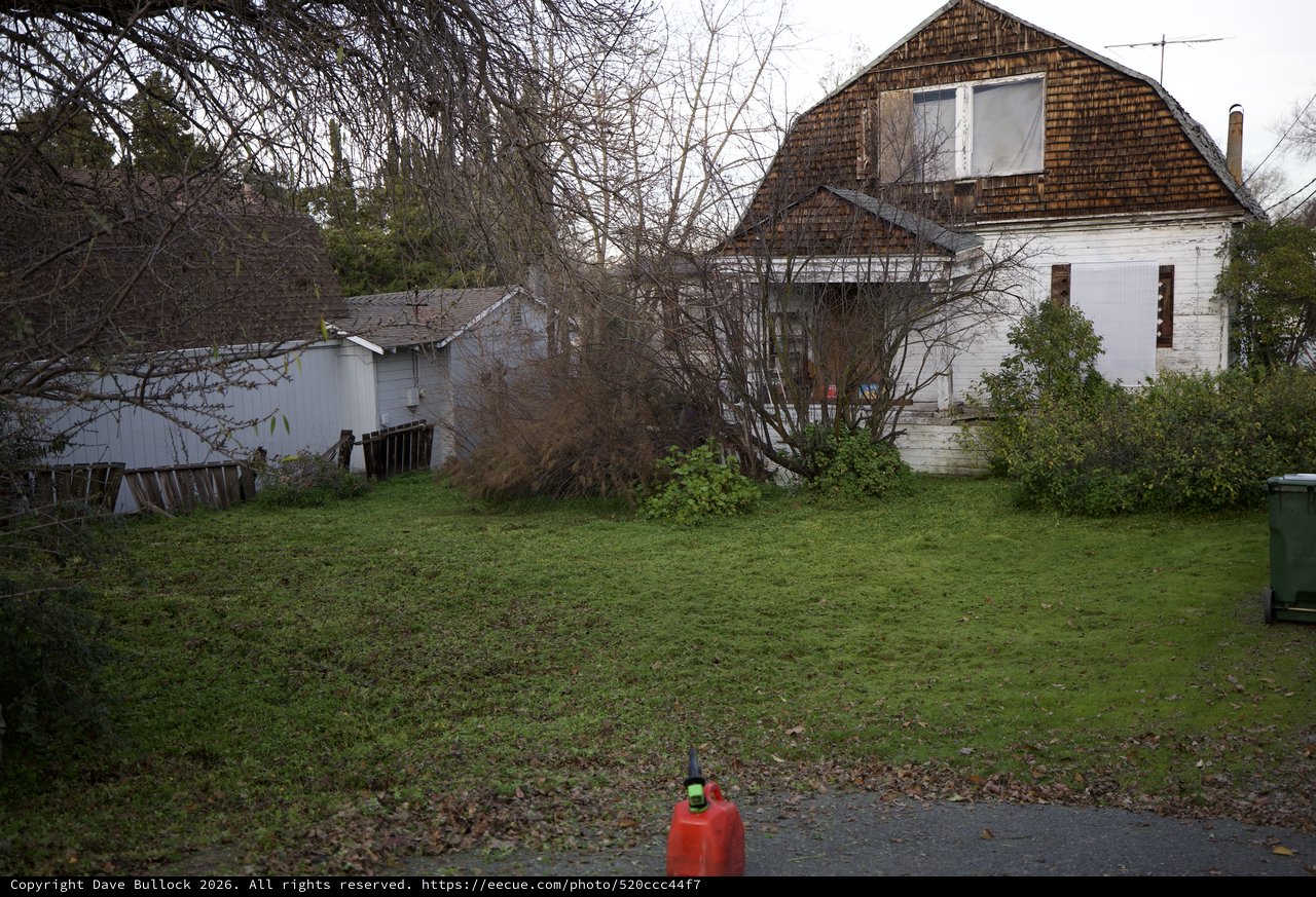 Abandoned Rural Property with Weathered Barn and Outbuildings