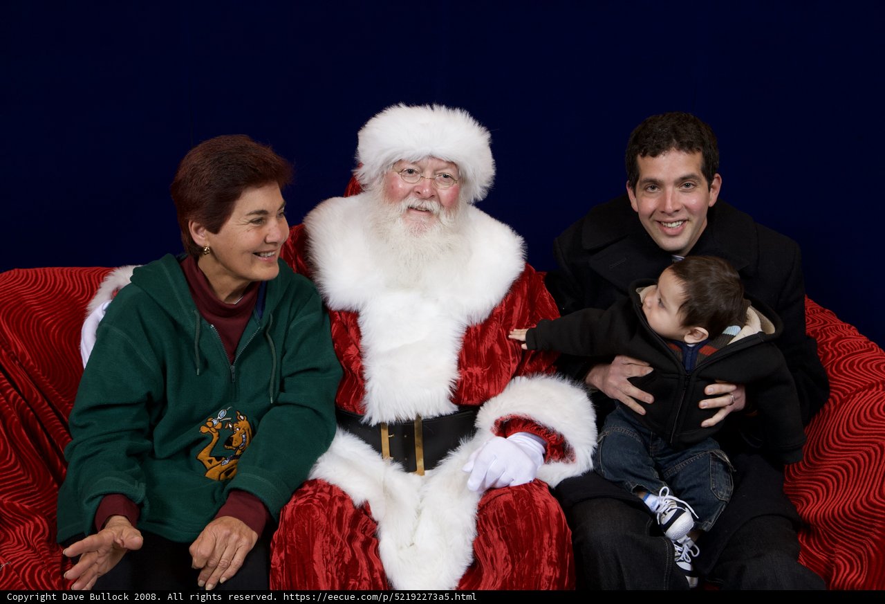Festive family photo with Santa Claus