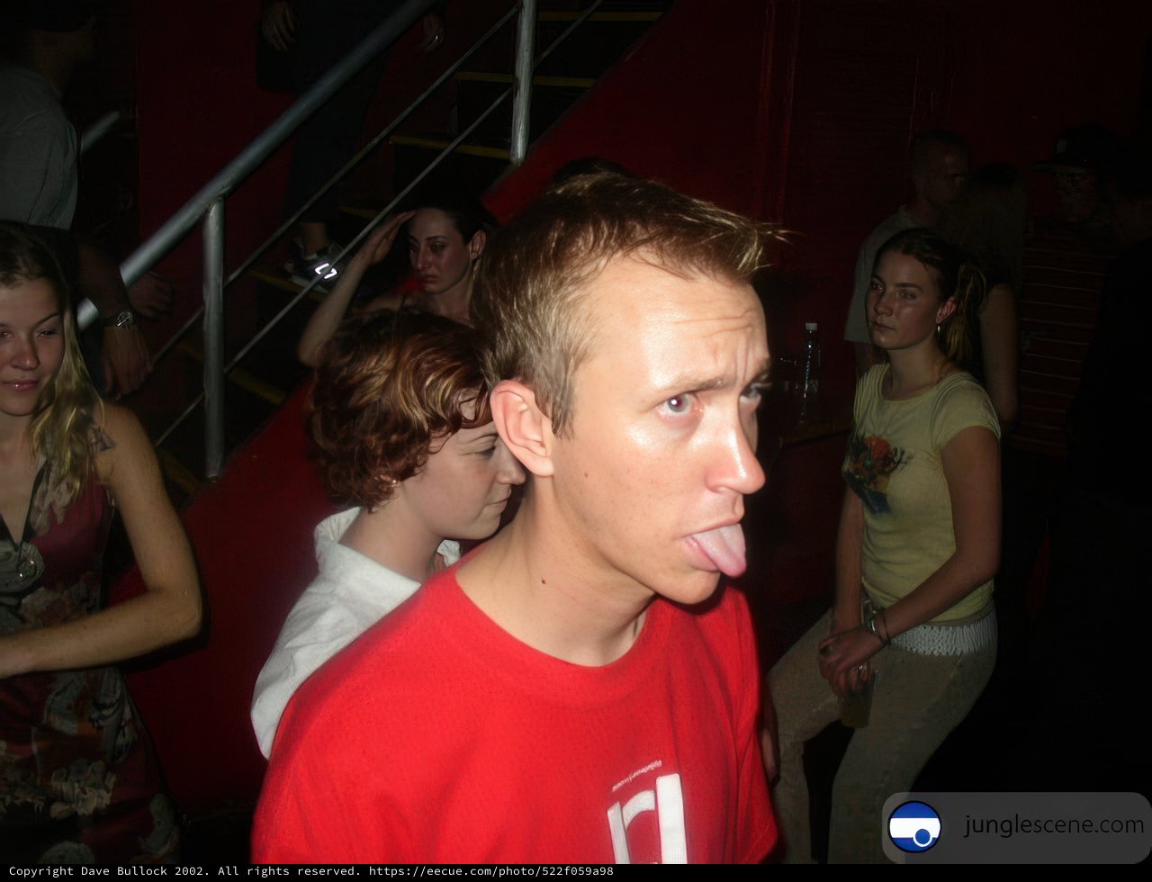 Tounge-out Teen at Nightclub Premiere