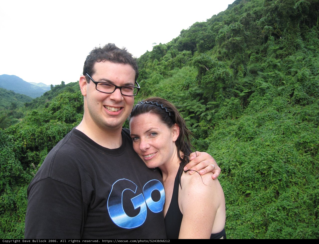 Couple Smiling Against Lush Fiji Jungle Hillside