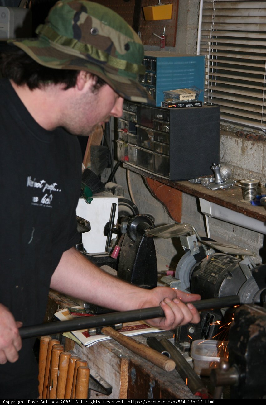 Man in a Hat at the Manufacturing Site