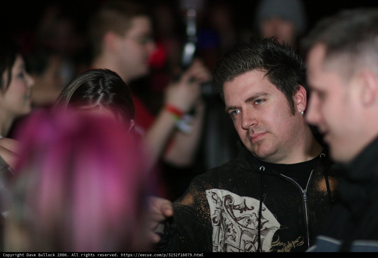 Pink-haired Man Among the Crowd