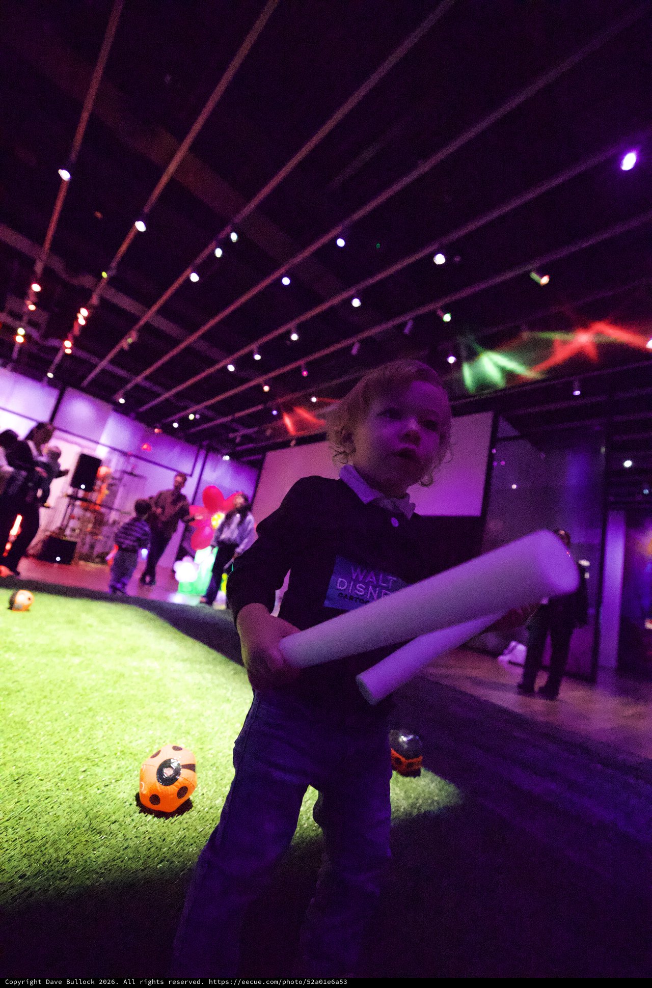 Toddler Dancing at Baby Rave Event with Purple Lights